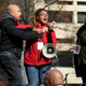 Erika Totten (center) struggles for the microphone to ensure that her voice would be heard during the Justice for All march on Saturday.
Nicole L. Cvetnic/The Root